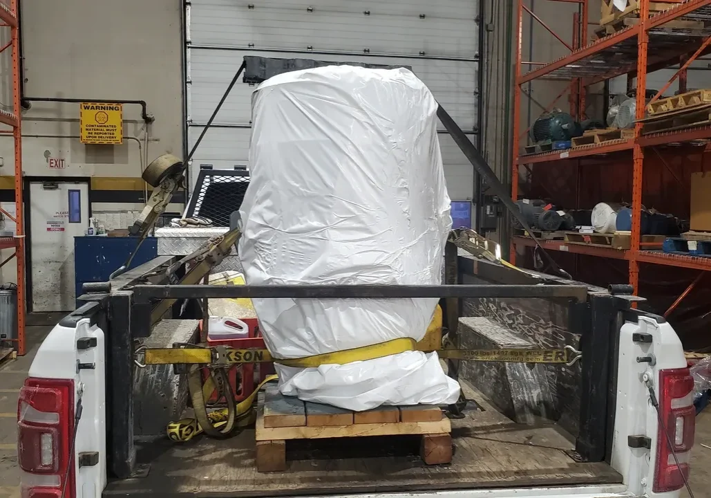 Palletized load secured in pickup truck