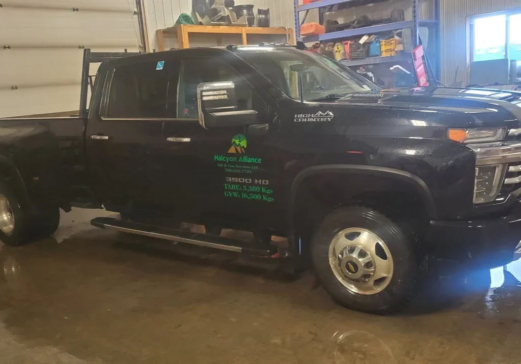 Black pickup truck in a garage